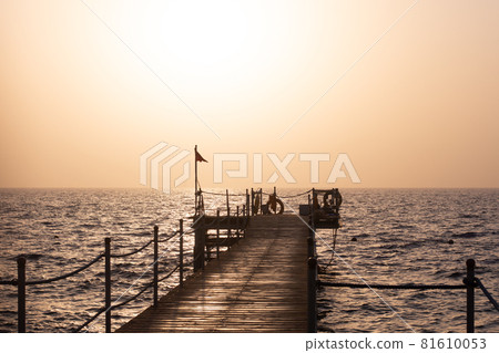 pier at dawn. against the background of the red sea 81610053