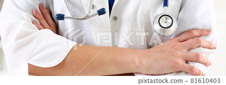 Female medicine doctor hands crossed on her chest 81610403