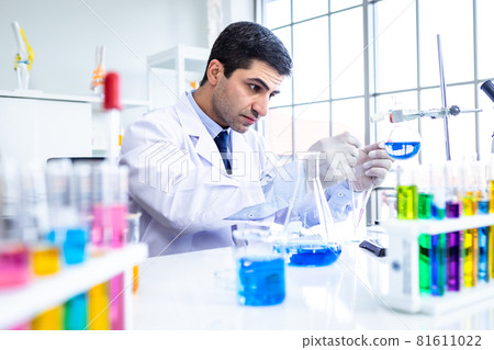 Confident scientist portrait of Happy male scientist in a chemistry lab scientist holding test tube with sample in Laboratory analysis background Confident scientist portrait of Happy male scientist in a chemistry lab scientist holding test tube with sample in Laboratory analysis background 81611022