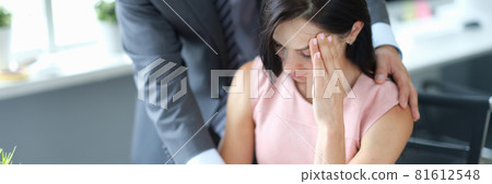 Businessman calming down young fatigue colleague at workplace Businessman calming down young fatigue colleague at workplace 81612548