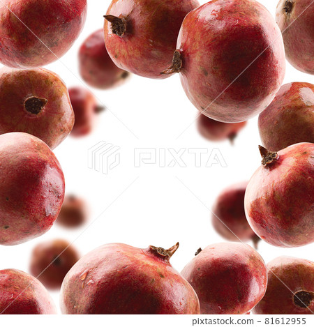 Ripe pomegranates levitate on a white background 81612955