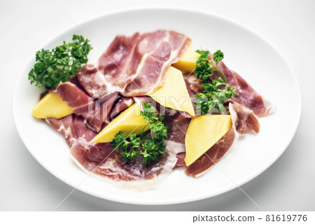 jamon serrano parma prosciutto style smoked ham with mango fruit 81619776