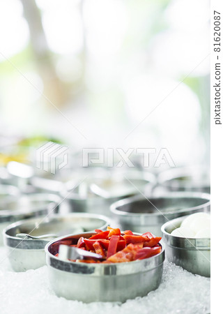 bowls of mixed fresh organic vegetables in salad bar display 81620087