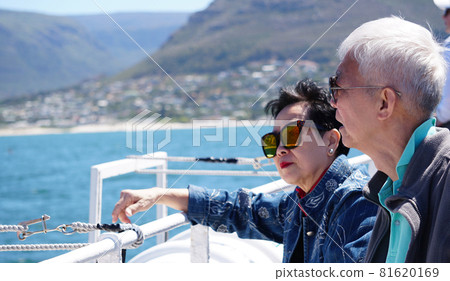 Asian senior elderly couple on tourist ferry boat to seals islan Asian senior elderly couple on tourist ferry boat to seals islan 81620169