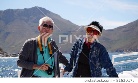 Asian senior elderly couple on tourist ferry boat to seals islan 81620173