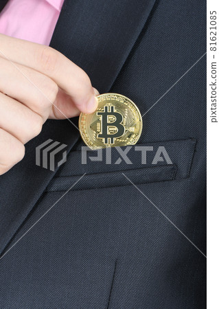 Man's hand holding golden Bitcoin isolated on white Man's hand holding golden Bitcoin isolated on white 81621085