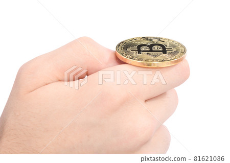 Man's hand holding golden Bitcoin on white background. 81621086