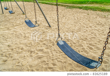 empty swings in playground empty swings in playground 81625189