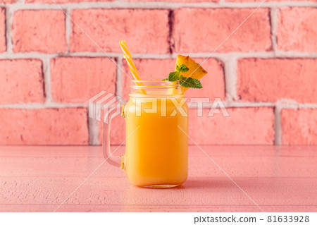 Tropical pineapple smoothie in a mason jar. Tropical pineapple smoothie in a mason jar. 81633928