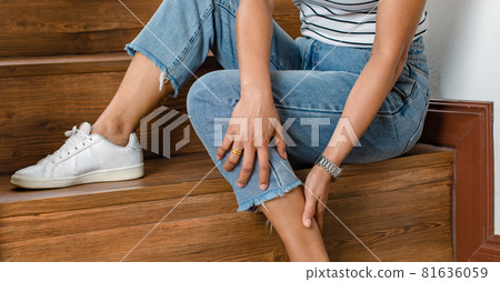 Woman cannot walk climb stair, she stops and use hand hold leg with feeling pain, suffers, hurt and tingling. Concept of Guillain barre syndrome and numb hands disease effect Woman cannot walk climb stair, she stops and use hand hold leg with feeling pain, suffers, hurt and tingling. Concept of Guillain barre syndrome and numb hands disease effect 81636059