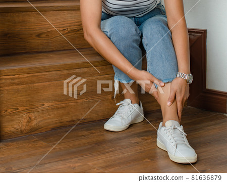 Woman cannot walk climb stair, she stops and use hand hold leg with feeling pain, suffers, hurt and tingling. Concept of Guillain barre syndrome and numb hands disease effect Woman cannot walk climb stair, she stops and use hand hold leg with feeling pain, suffers, hurt and tingling. Concept of Guillain barre syndrome and numb hands disease effect 81636879