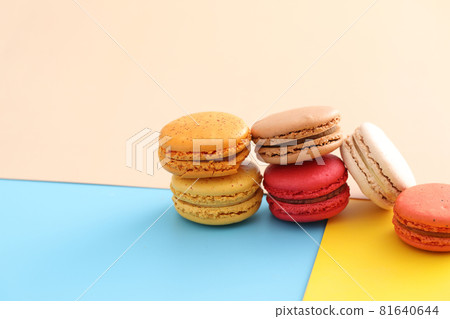 Colorful macarons isolated in pastel background 81640644
