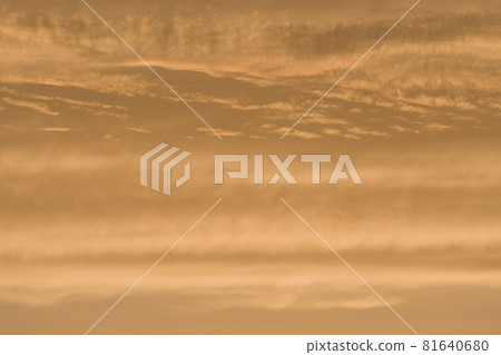 Abstract sky background of deep golden sunset clouds. Full frame 81640680