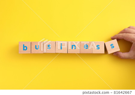 Business concept wooden blocks with word business strategy icons on yellow background 81642667