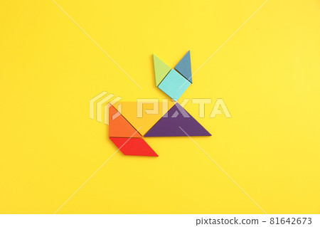 Wooden blocks cat isolated in yellow background 81642673