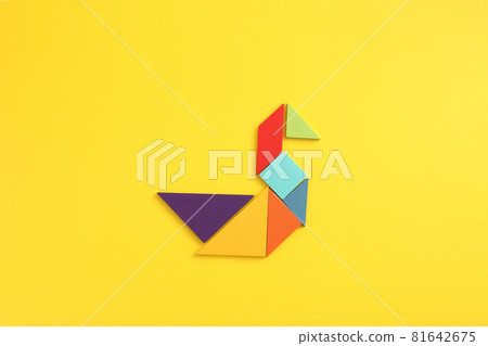 Wooden blocks duck isolated in yellow background Wooden blocks duck isolated in yellow background 81642675