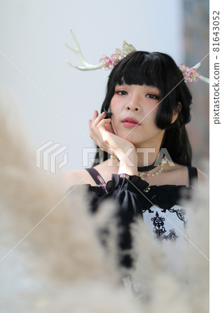 Portrait of asian girl in lolita fashion dress in vintage garden background 81643052