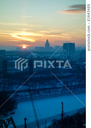 Cold winter Moscow skyline, setting sun and frozen river Cold winter Moscow skyline, setting sun and frozen river 81643489
