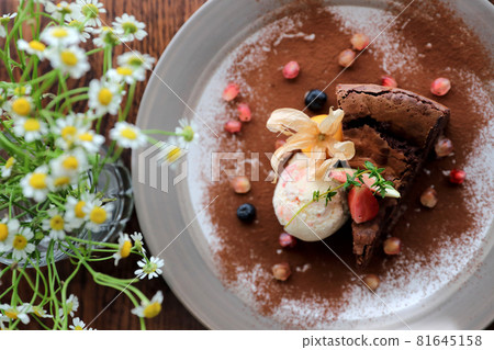 Chocolate cake with ice cream dessert on wood table Chocolate cake with ice cream dessert on wood table 81645158