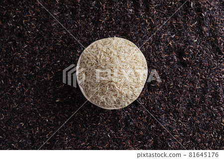 Organic raw brown rice and riceberry rice in close up Organic raw brown rice and riceberry rice in close up 81645176