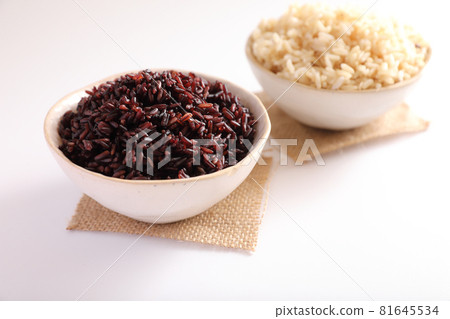 Organic boiled brown rice on bowl isolated in white background Organic boiled brown rice on bowl isolated in white background 81645534