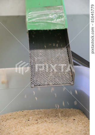 Factory machine Milling rice in close up Factory machine Milling rice in close up 81645779