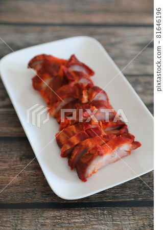 Roasted pork thai local food with red sauce on wood background Roasted pork thai local food with red sauce on wood background 81646196