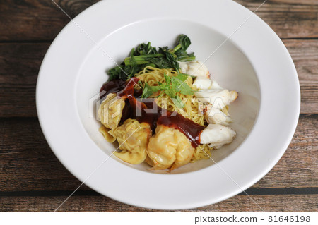 Shrimp dumpling noodles and crab meat on wood background Shrimp dumpling noodles and crab meat on wood background 81646198
