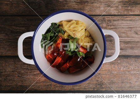 Shrimp dumpling with roasted pork on wood background Shrimp dumpling with roasted pork on wood background 81646377