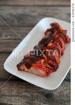 Roasted pork thai local food with red sauce on wood background Roasted pork thai local food with red sauce on wood background 81646378
