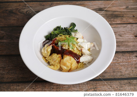 Shrimp dumpling noodles and crab meat on wood background Shrimp dumpling noodles and crab meat on wood background 81646379