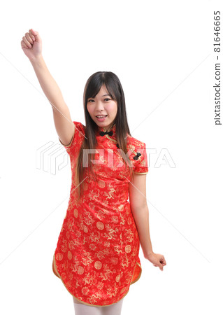 beauty woman wear red cheongsam looking and smile in chinese new year 81646665