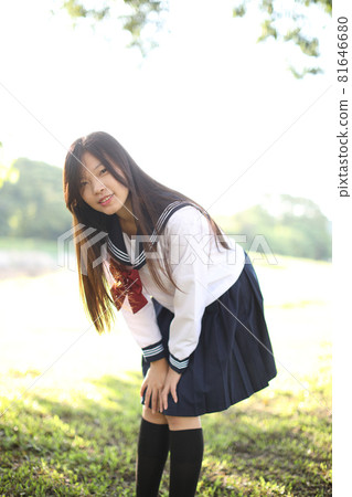 Asian school girl with countryside background 81646680