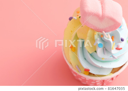 colorful cupcake isolated in pink background colorful cupcake isolated in pink background 81647035