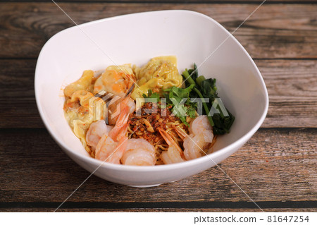 Shrimp dumpling with shrimp on wood background Shrimp dumpling with shrimp on wood background 81647254