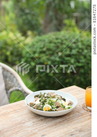 caesar salad appetizer on wooden background 81647278