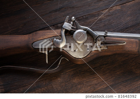 17th century ancient flintlock musket with powder flask and led bullets. 17th century ancient flintlock musket with powder flask and led bullets. 81648392