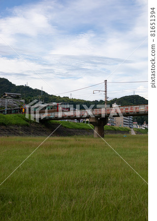 EOS5D. Hiroshima Yokokawa Station, train on the riverbank. 81651394