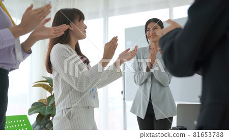 Businesswoman proficiently present work project receive celebrations from team Businesswoman proficiently present work project receive celebrations from team 81653788