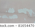 Pink cement wall background cracked and peeling paint 81654470