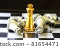 gold King chess surrounded by a number of fallen silver chess pieces , business strategy concept 81654471