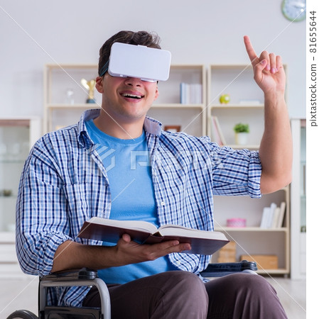 Disabled student studying with virtual reality glasses 81655644