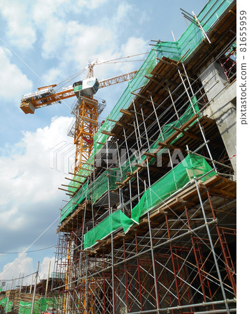 JOHOR, MALAYSIA -JULY 29, 2016: Scaffolding used as the temporary structure to support platform, form work and structure at the construction site. Also used it as a walking platform for workers.  81655959