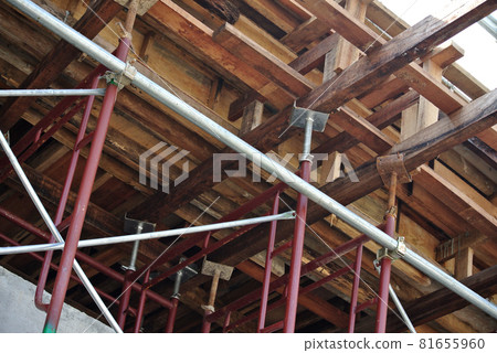 JOHOR, MALAYSIA -JULY 29, 2016: Scaffolding used as the temporary structure to support platform, form work and structure at the construction site. Also used it as a walking platform for workers.  81655960