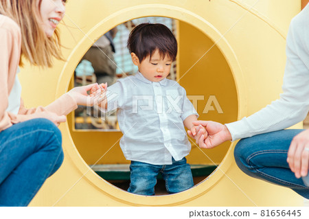 Children and parents playing with playset Children and parents playing with playset 81656445