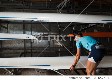 Sportsman single scull man rower prepare to competition with boat 81657597