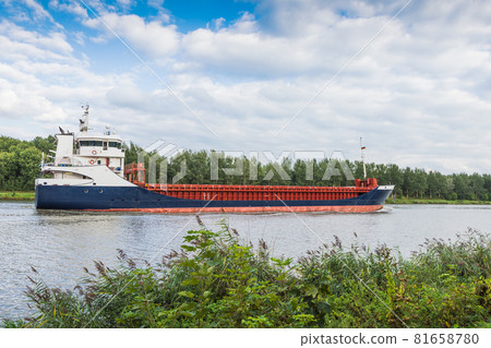 Cargo ship on the Kiel Canal near Hochdonn, Schleswig-Holstein, Germany 81658780