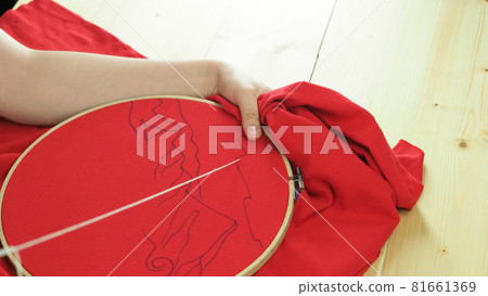 Embroider sewing by woman hand. Craft work and female hands. Handicraft work by thread needle sew knit. Wood frame embroidery hoop. Needlework handicraft crafting quarantine leisure concept. Embroider sewing by woman hand. Craft work and female hands. Handicraft work by thread needle sew knit. Wood frame embroidery hoop. Needlework handicraft crafting quarantine leisure concept. 81661369