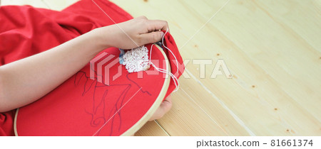 Embroider sewing by woman hand. Craft work and female hands. Handicraft work by thread needle sew knit. Wood frame embroidery hoop. Needlework handicraft crafting quarantine leisure concept. Embroider sewing by woman hand. Craft work and female hands. Handicraft work by thread needle sew knit. Wood frame embroidery hoop. Needlework handicraft crafting quarantine leisure concept. 81661374