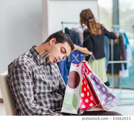 Man waiting for his wife during christmas shopping 81662015